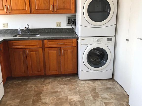 Washer & Dryer in a location away from bedrooms.