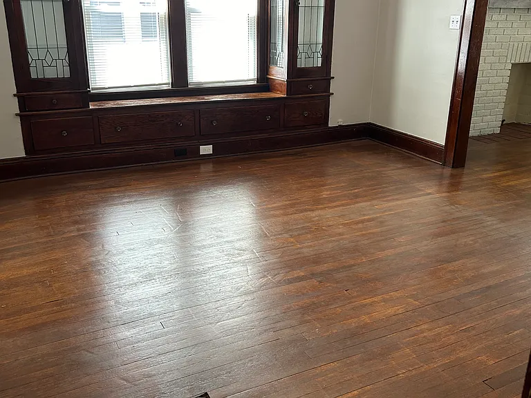 Dining Room with original leaded glass shelving units and refinished original wooden floors