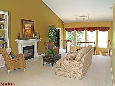 Main level living area, fireplace #1, Atrium windows