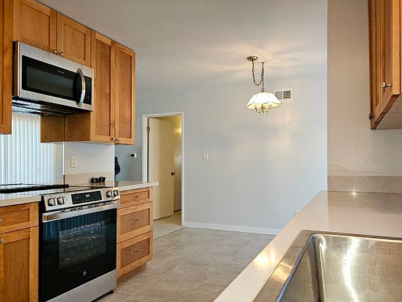 Kitchen from side entrance facing dining area