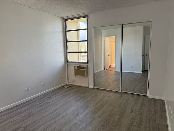 Primary bedroom with large mirror closet