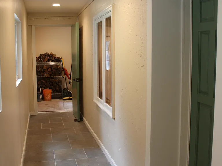 Private hallway accesses apartment front door.
