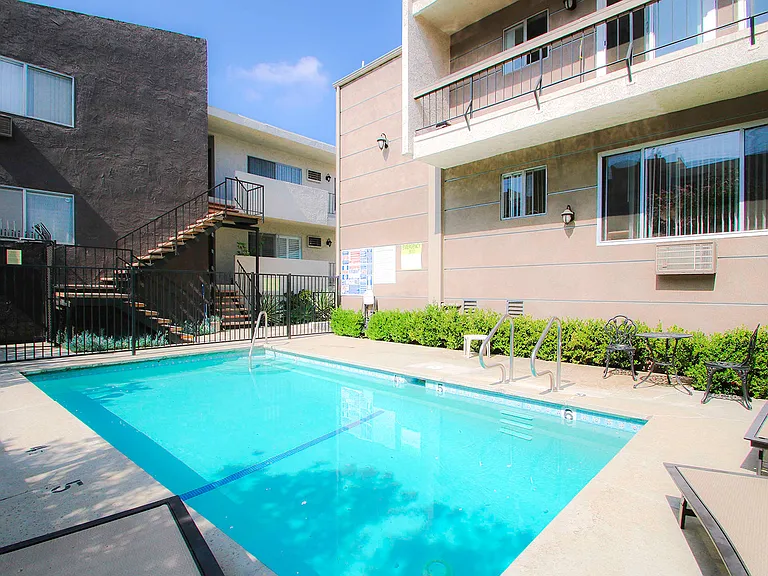 Beautiful courtyard pool with lounging space.