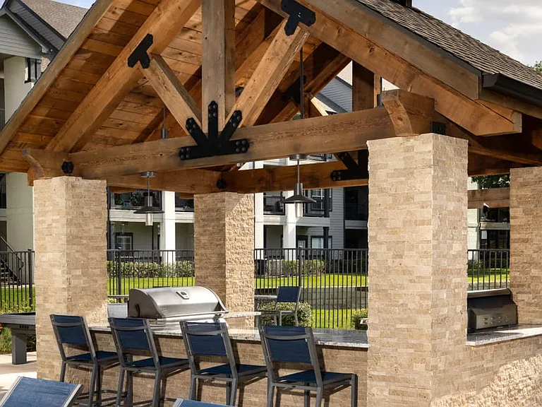 Outdoor kitchen features built-in BBQ grills