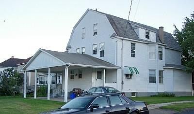 Entrance to rental is on far side of carport