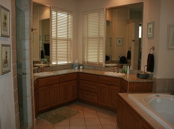 Master Bath: Granite Double Vanity, Jetted Oversized Tub, Standing Travertine 