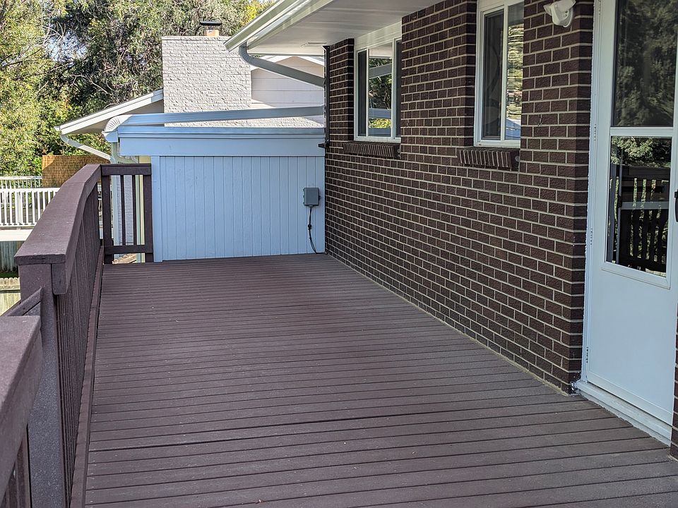 The deck is outside the kitchen.