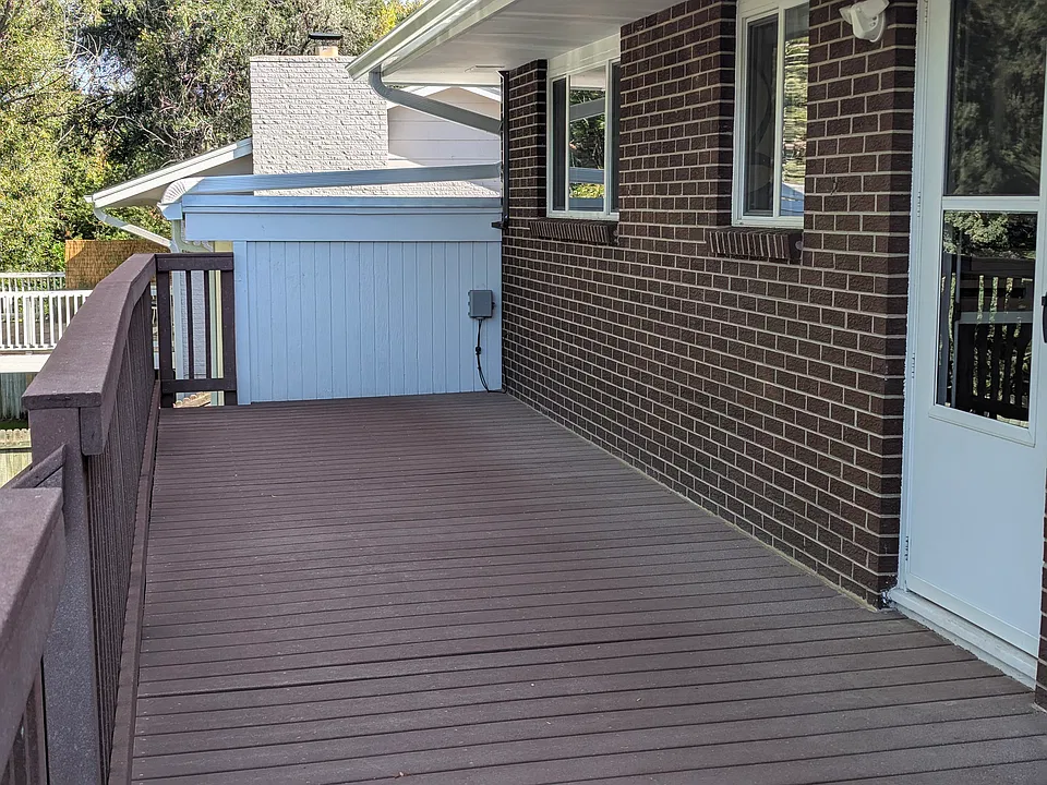 The deck is outside the kitchen.