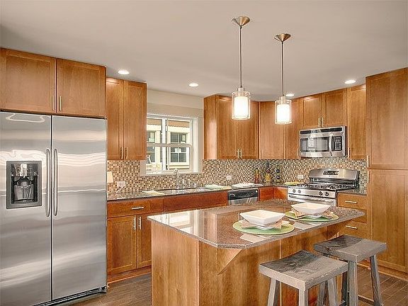 Chef's kitchen with island and granite