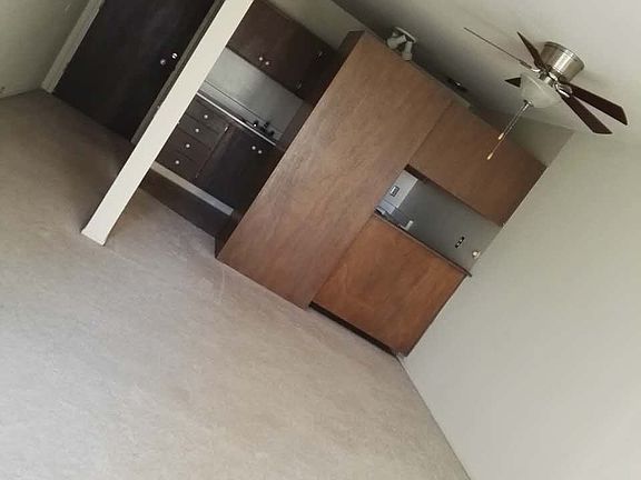 a big living room with kitchen