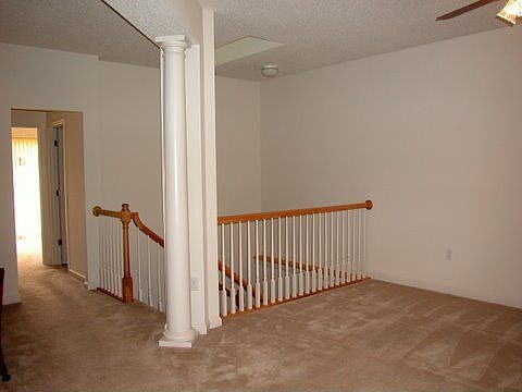 Stunning skylighted wrap around staircase to the lower level rec room