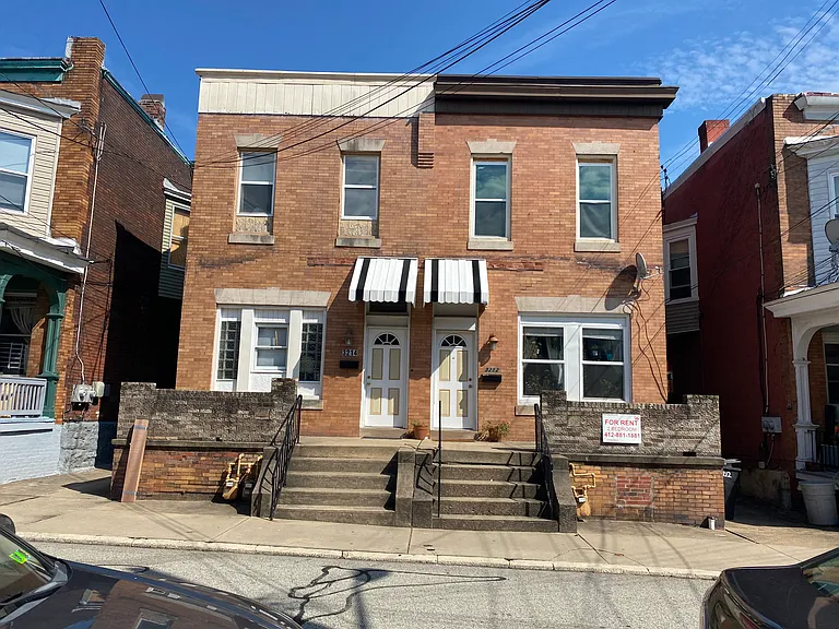 3214 Joe Hammer is the left half of the building. You enter apartment 2 through a stairwell on the side.