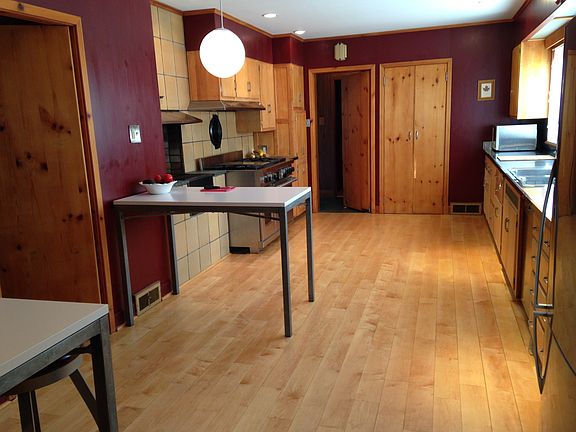 Kitchen, 48" Wolf Stove, stainless counters, Maple floor, ea