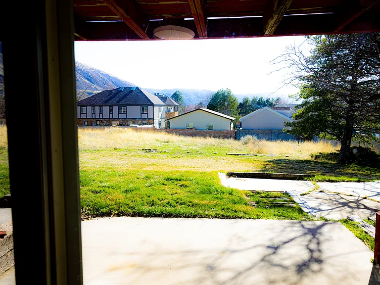 view of the back yard from the downstairs living room.
