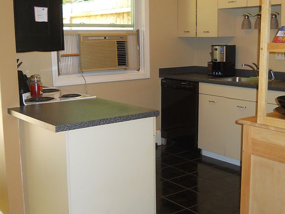 Kitchen with refrigerator, dishwasher, electric stove/oven,