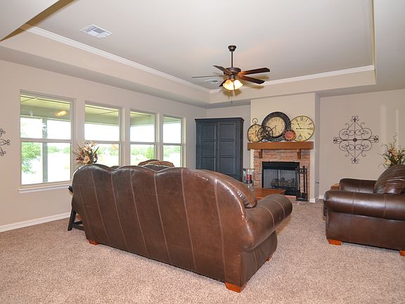 Spacious family rm w/stone fireplace.