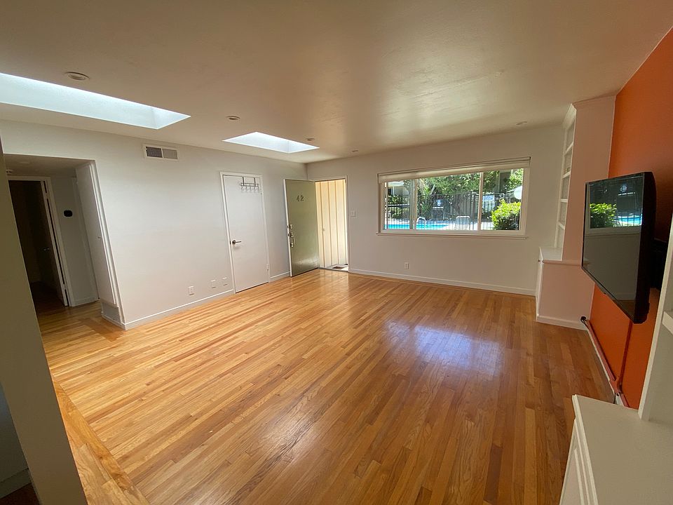 Spacious Living Room with two big Skylights.