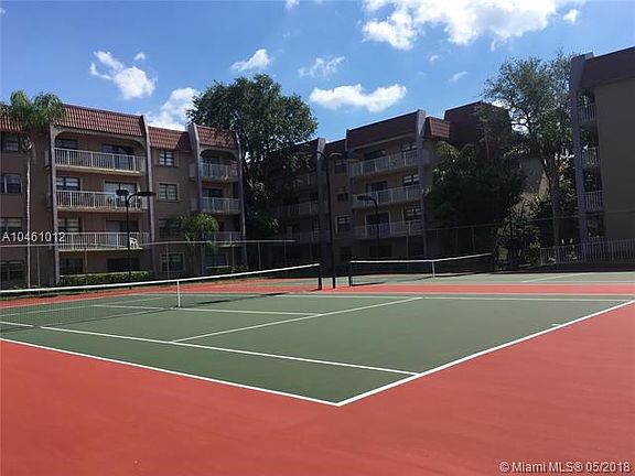 Two tennis courts within the complex.