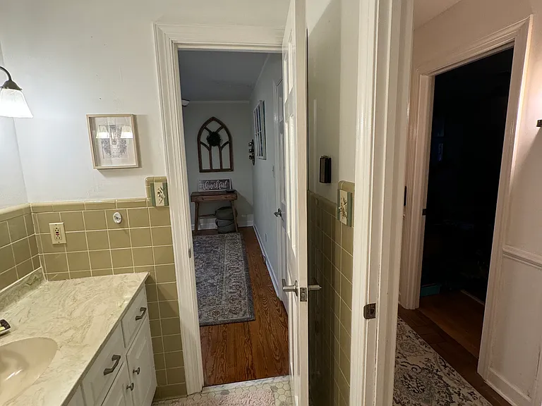 Downstairs Left shared bathroom with shower and tub