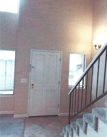Front Door w/Stairway to Second Floor