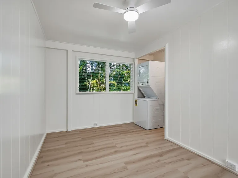 The living/office area with ceiling fan.