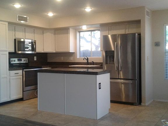 kitchen w/ white cabinets