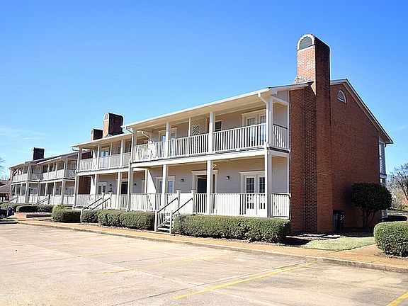 Experience comfortable living in this charming apartment complex, perfect for those seeking tranquility.