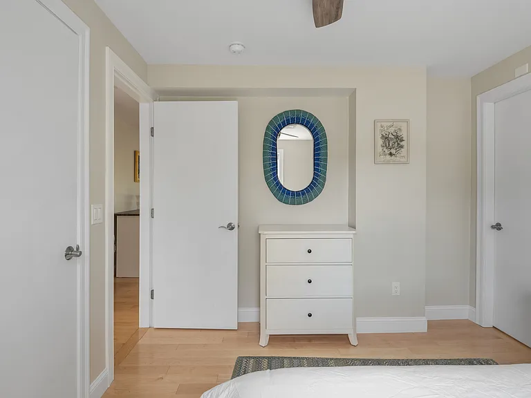 the second floor bedroom one with a full size bed