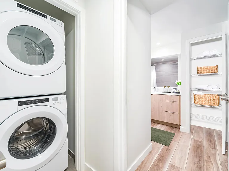 In-home laundry with built-in shelving keeps daily routines simple and organized_designed for the way residents live at Modera Aventura.