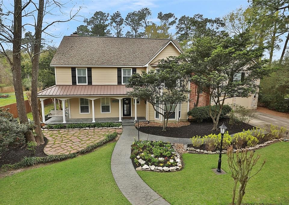 COUNTRY LIVING IN A GATED COMMUNITY OF TOMBALL. Wonderfully maintained 4 bedroom home with a wrap around porch. Almost a full acre of manicured landscaped yard.