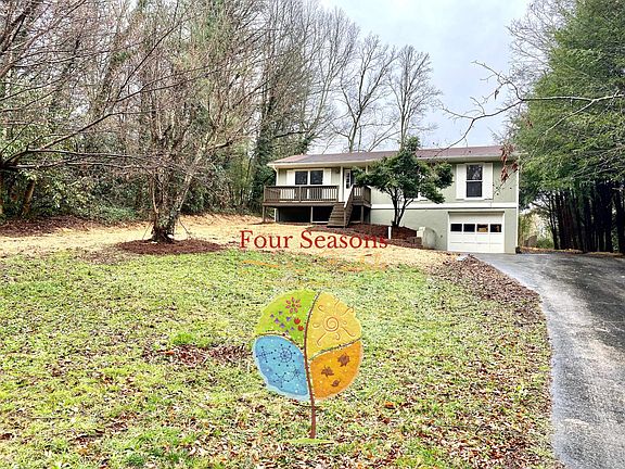 Paved driveway and one car garage