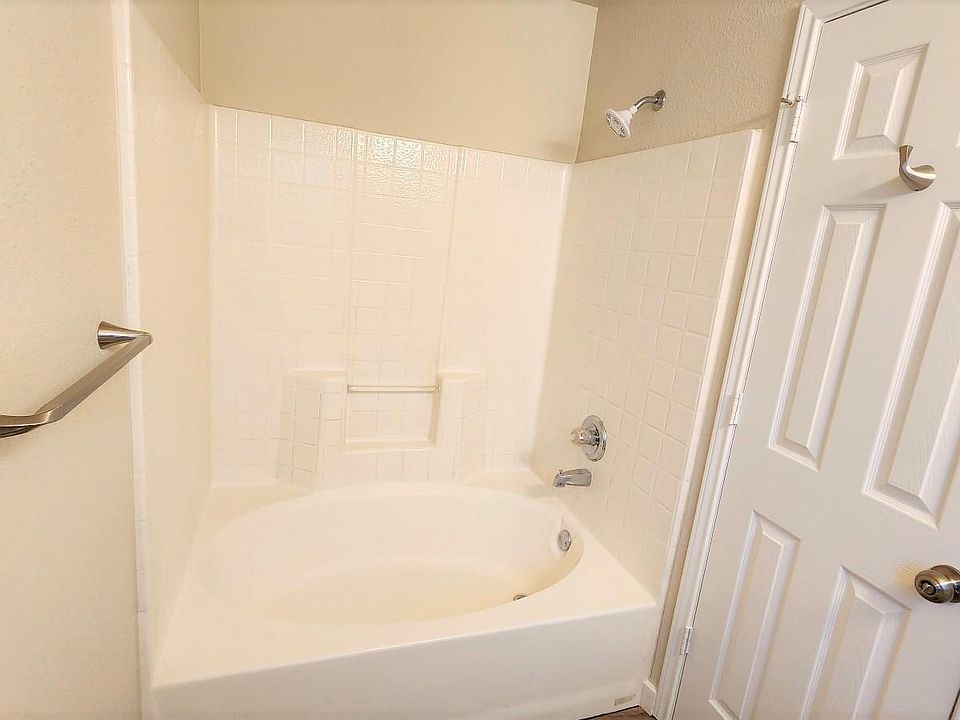 Oversize tub and modern fixtures in bathroom.