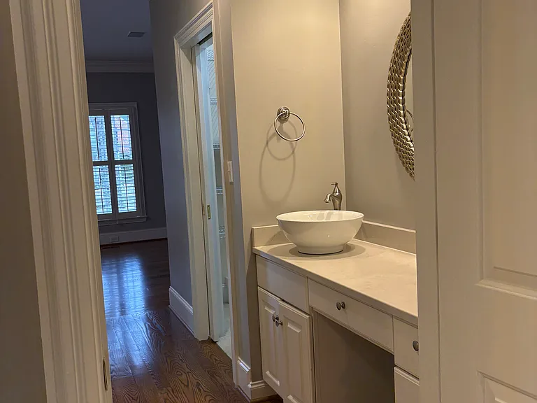 Primary dressing area with dual closets