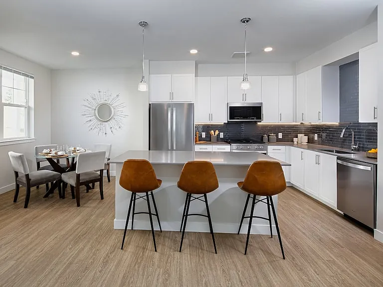 Renovated Package II kitchen and dining areas with hard surface flooring