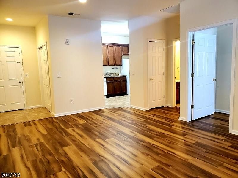 Open Floor plan w/ new hardwood floors, recessed lights in each room and freshly painted