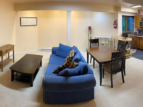 Apartment with bedroom (left), living room (center) and kitchen (right).