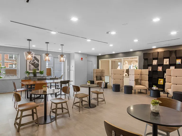 Spacious resident lounge at The Amelia Apartments in Quincy, MA