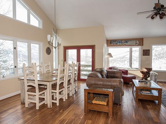 Entry hallway into living / dining room. Views overlooking Park City