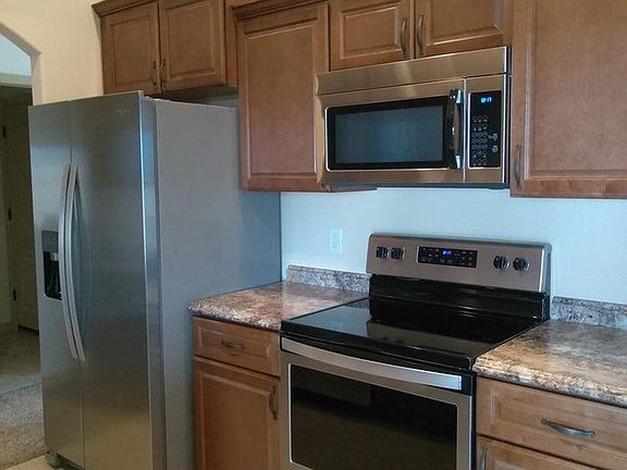smooth top electric range and oven, microwave, side by side refrigerator freezer