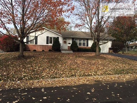 Newer asphalt driveway and newer concrete sidewalk to front door.