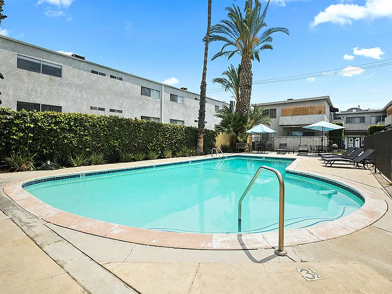 One of two large gated pools and lounging area.