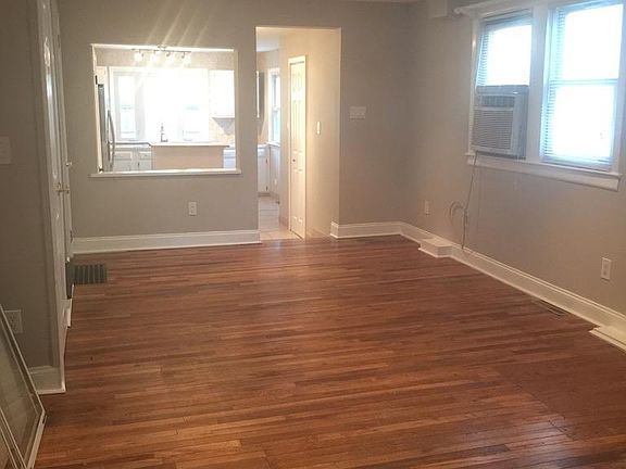 Living and dining area looking towards kitchen at rear