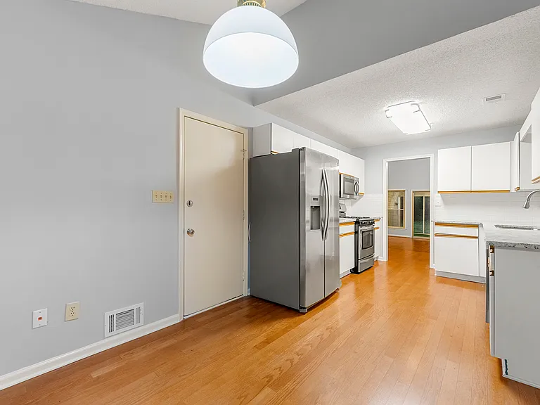 Kitchen, view from the breakfast area. Closed door on the left is the garage door. There is no walk in pantry available.