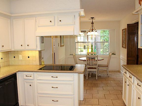 Beautiful light & bright kitchen is upgraded with Silestone counters, tile flooring, under cabinet l