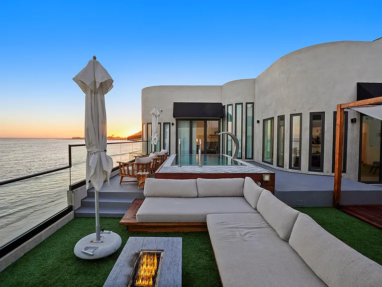 Unwind by the fire, where Malibu's cool nights meet the warmth of great company.