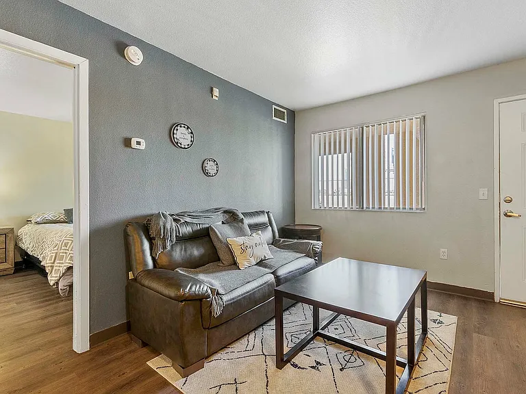 Step into comfort with this cozy living space, perfect for relaxation and style.