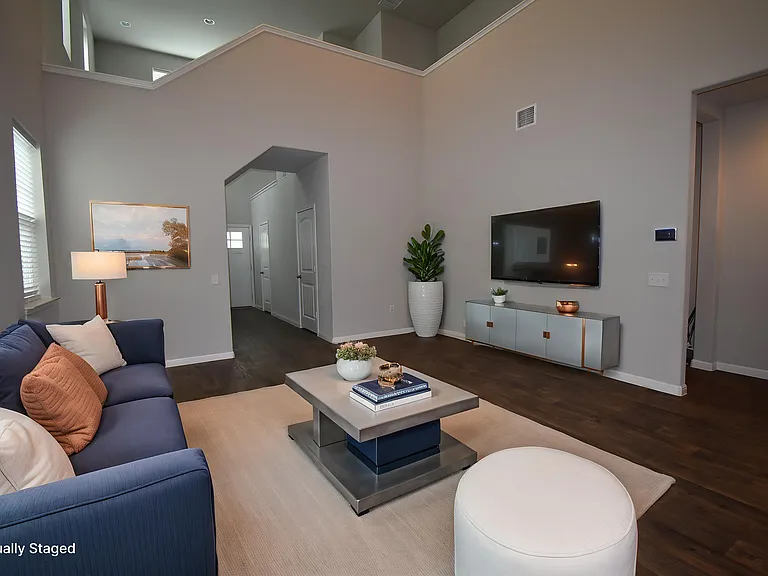 Virtually staged Living room with high ceilings