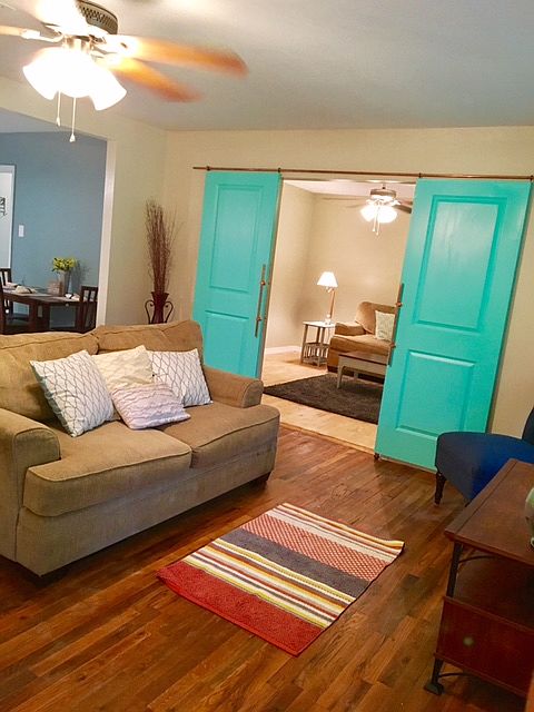 Living room looking into bed