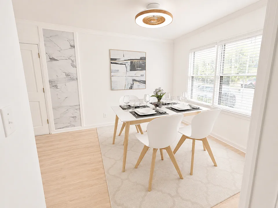 Bright dining room overlooking a sit out area