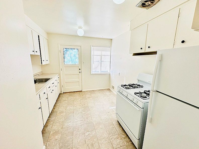 Experience culinary delight in this bright, well-equipped kitchen.